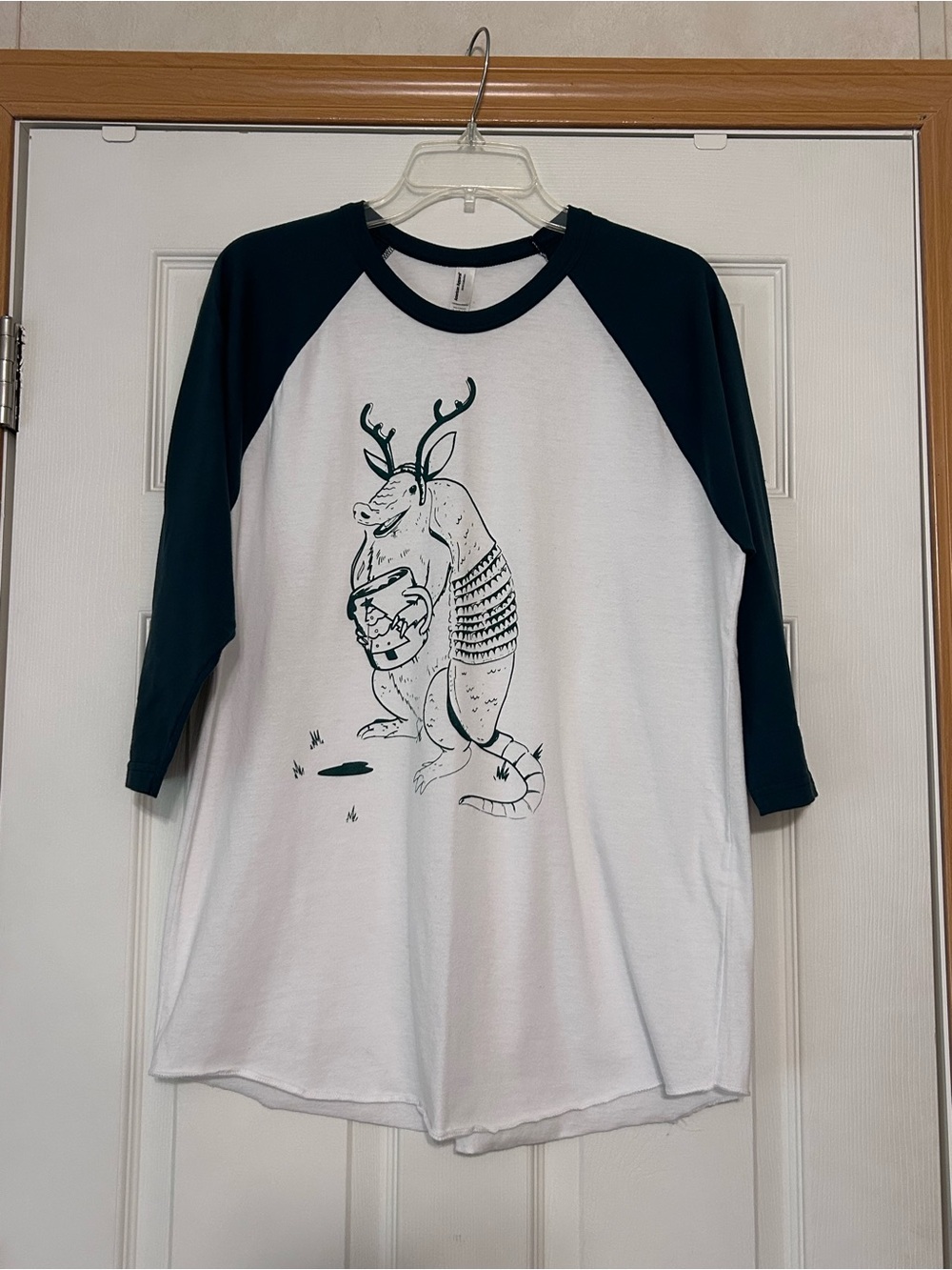 White and Dark Green Raglan Graphic Shirt - Armadillo with a Holiday Mug